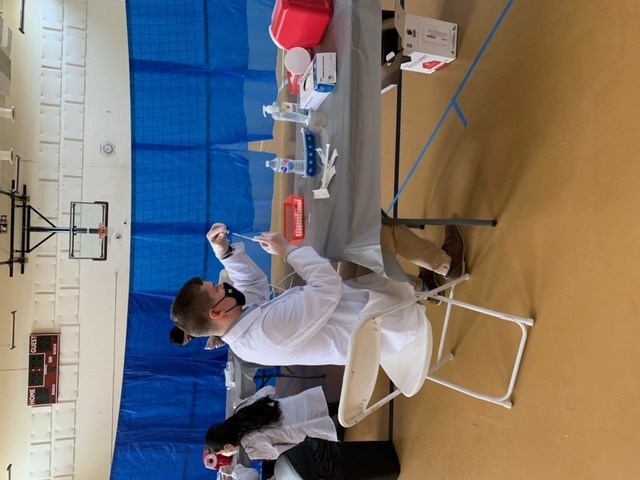 Jared Shinners prepares a vaccine 