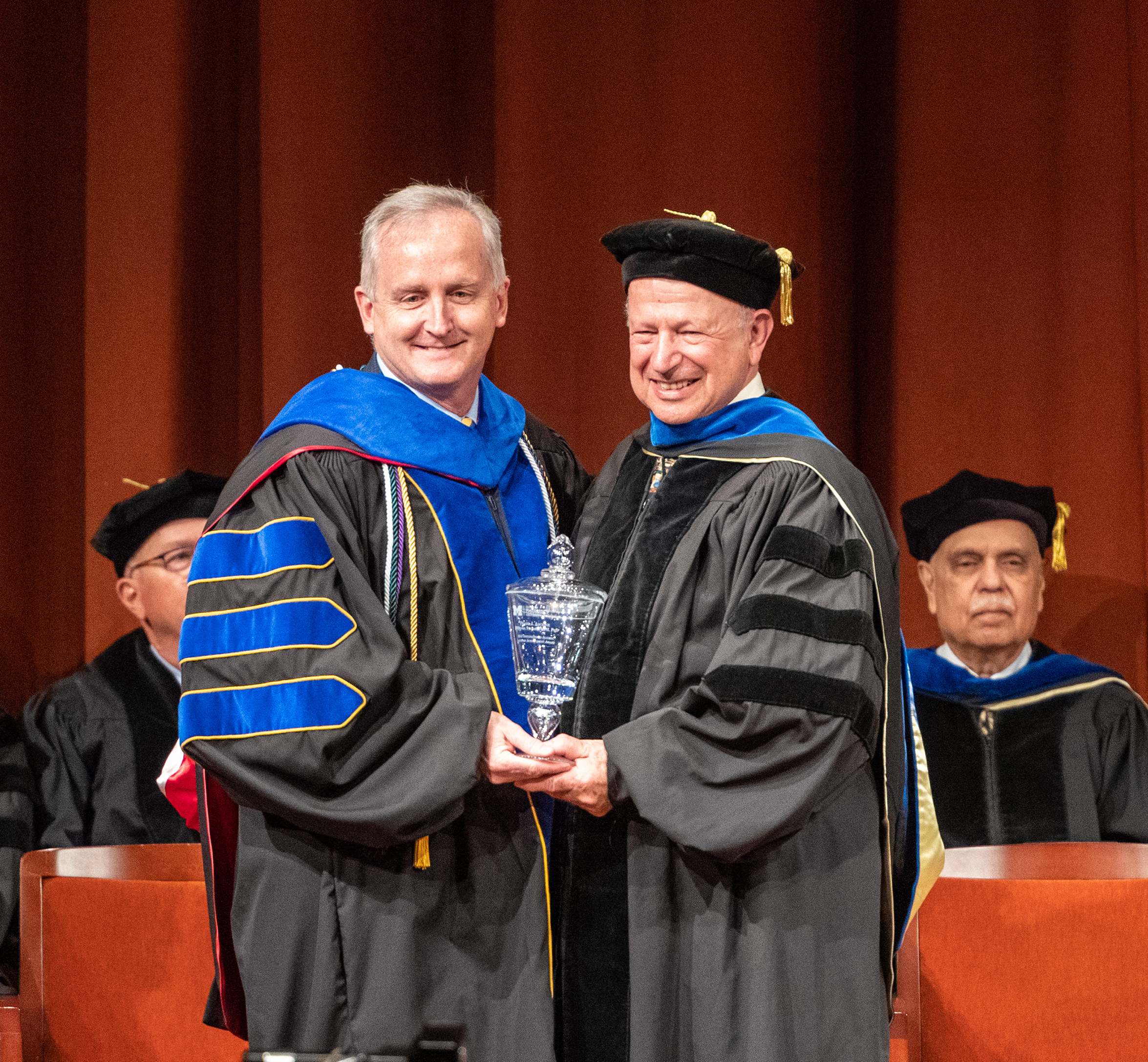 Dean James Dalton presents Dr. Ascione with the Distinguished Alumni Achievement Award
