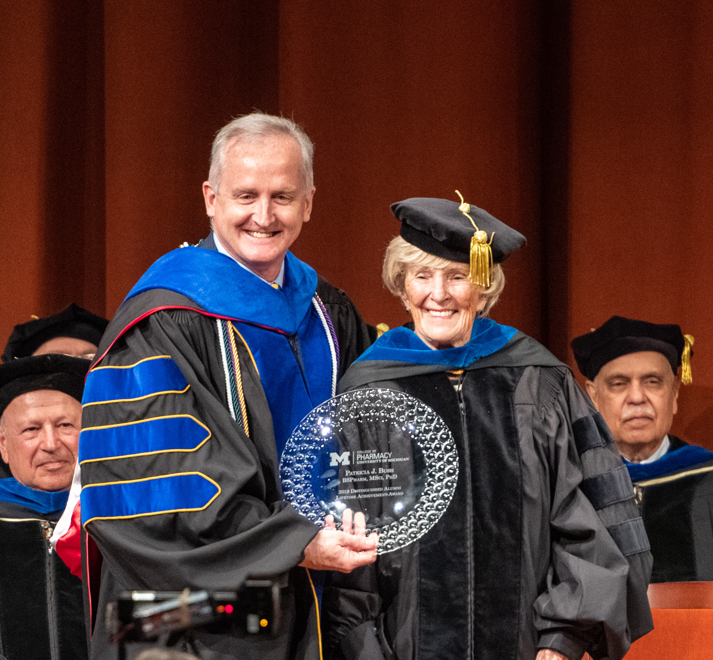 Dean James Dalton presents Dr. Bush with the Distinguished Alumni Achievement Award