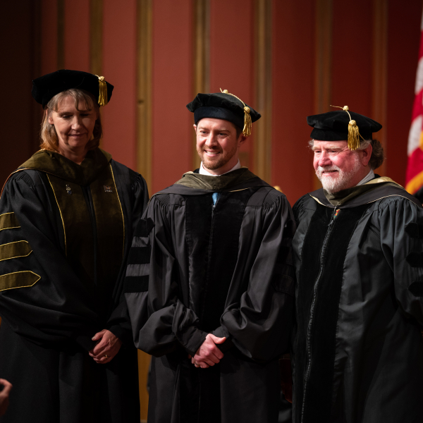 Austin and Grant Brown accept their award during the 2023 Michigan PharmD Commencement Ceremony.