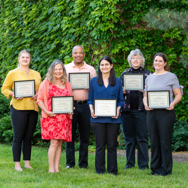 Members of the Office of Experiential Education and Community Engagement with their certificates from AACP
