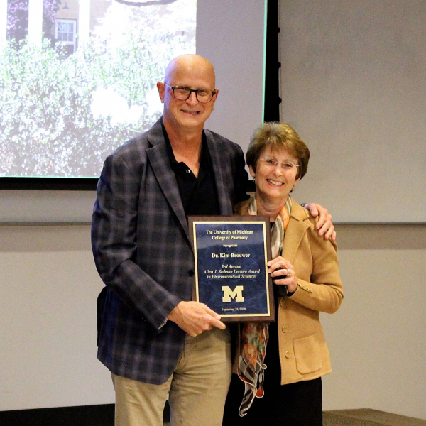Dr. David Smith presents Kim L.R. Brouwer with the Allen J. Sedman Lecture award. 