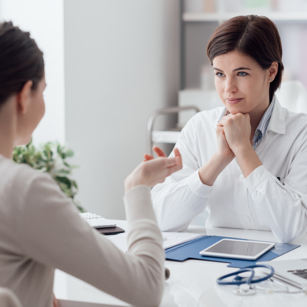 Pharmacist and patient discuss medication 