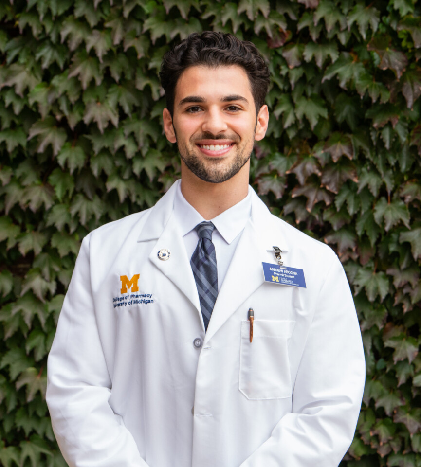Andrew Aboona Headshot, in his pharmacy white coat