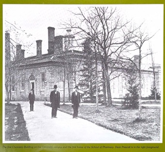 University of Michigan's first chemistry building. Albert B. Prescott standing in the background