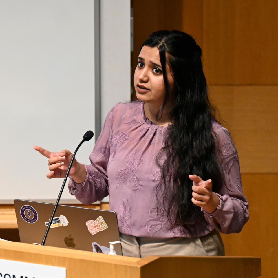 Woman presenting at a podium