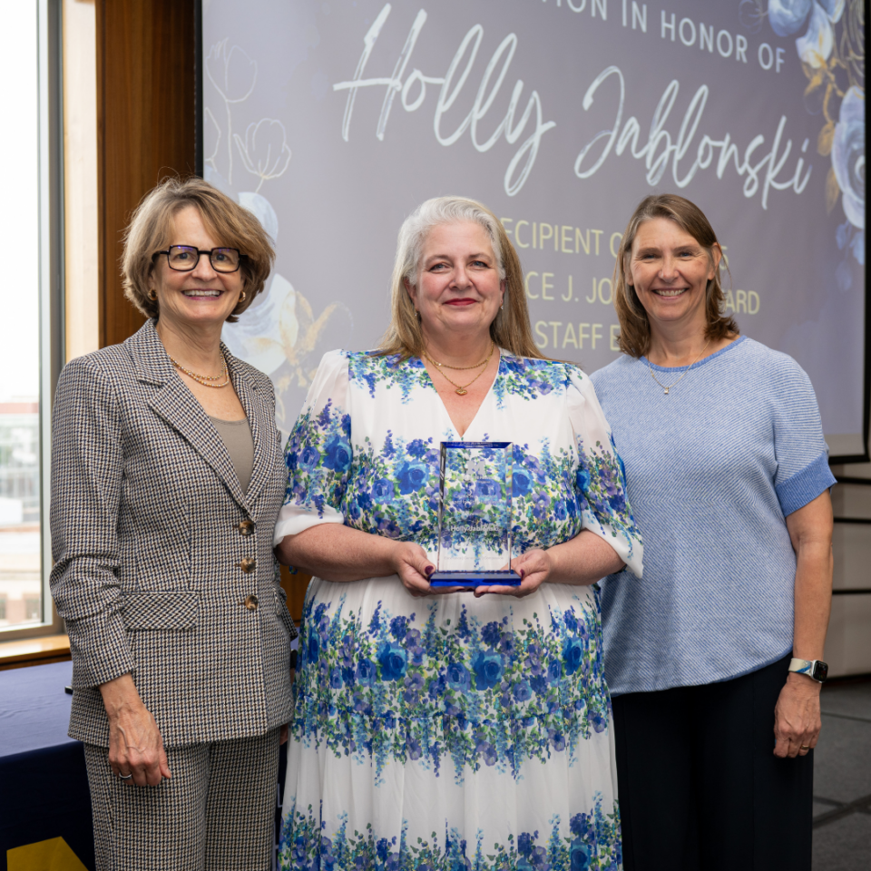 Associate Director Holly Jablonski poses with Provost Laurie McCauley and Dean Vicki Ellingrod to receive the Candace J. Johnson Award for Staff Excellence