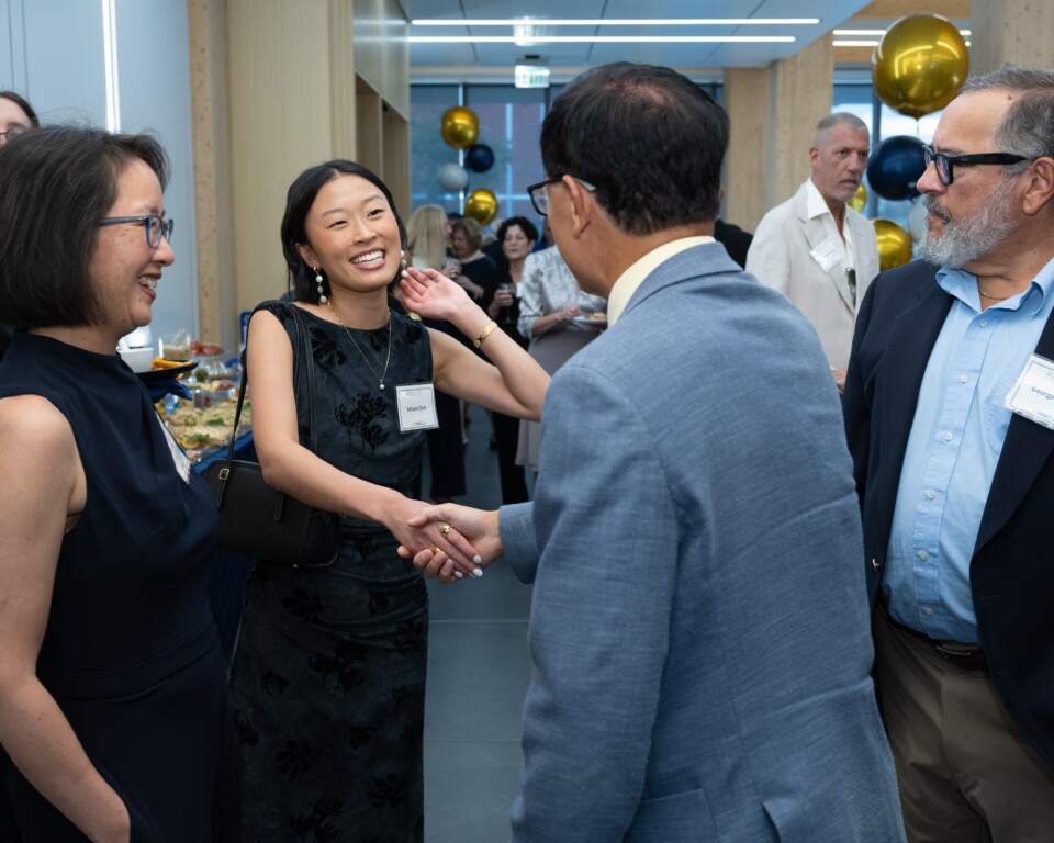 image of event guests shaking hands